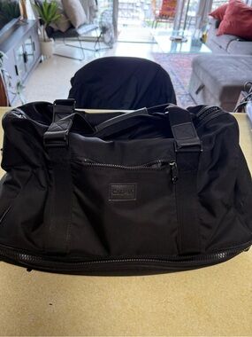 Calpak Black Men's Travel Duffel Bag with Front Zip Pocket